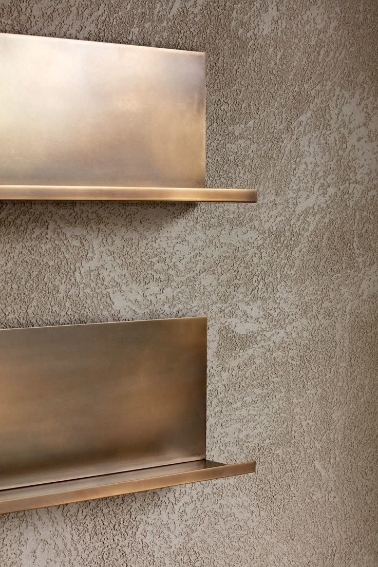 Two Brass Wall Shelves Mounted On A Textured Beige Wall — Everyday Interiors in Helensburgh, NSW