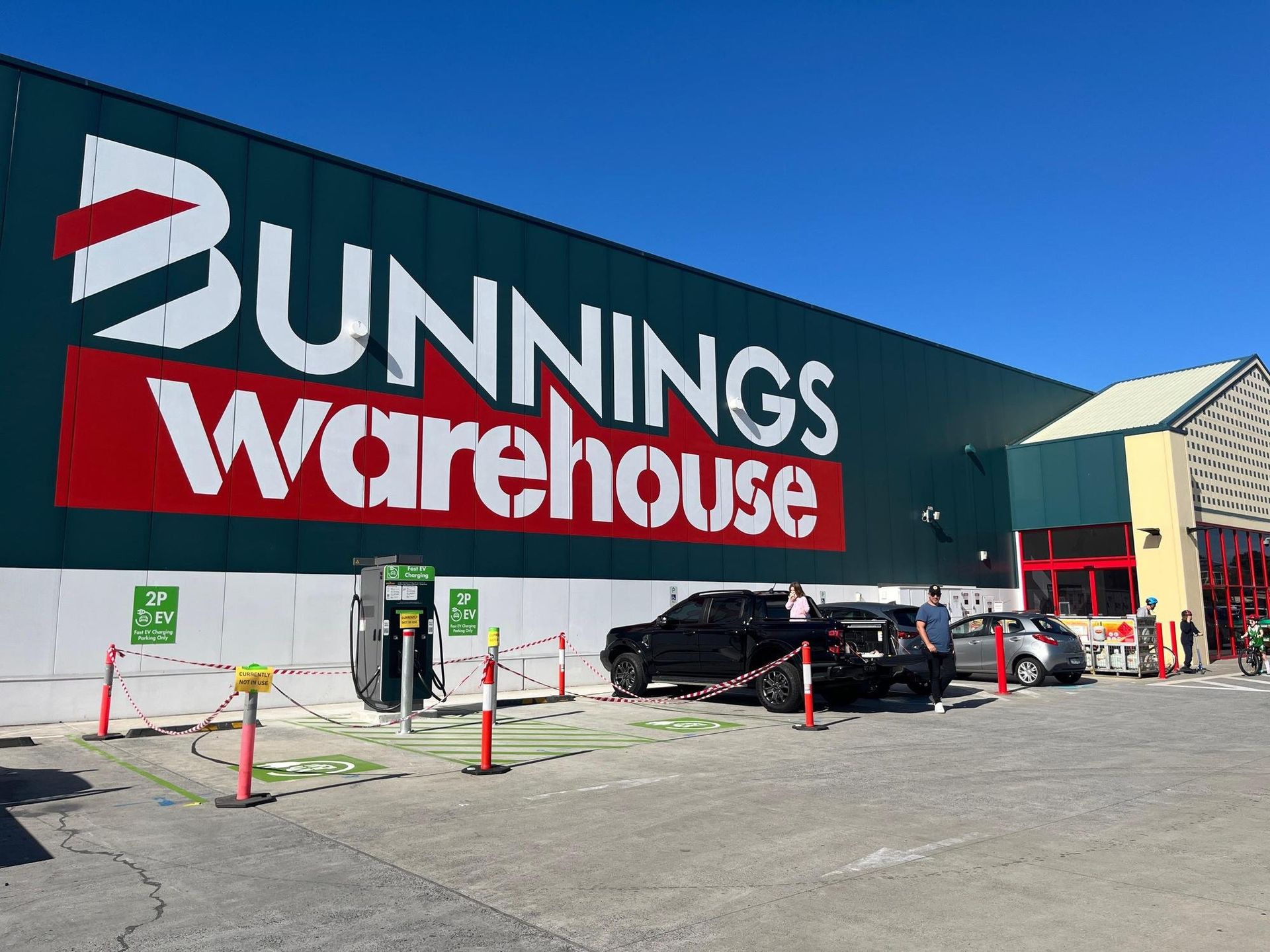 Bunnings Warehouse Storefront With Parked Cars And Shopping Carts — Everyday Interiors in Helensburgh, NSW