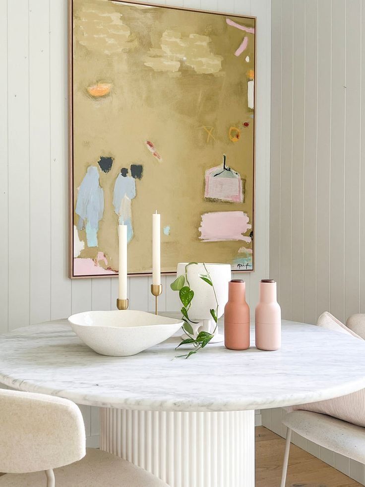 Round White Dining Table With Candles, Bowl And Pink Vases — Everyday Interiors in Helensburgh, NSW