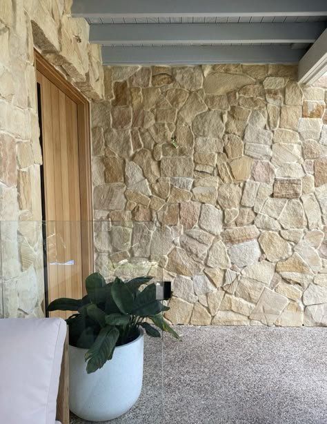 Stone Wall Patio With A Wooden Door And A Gray Ceiling Beams — Everyday Interiors in Helensburgh, NSW