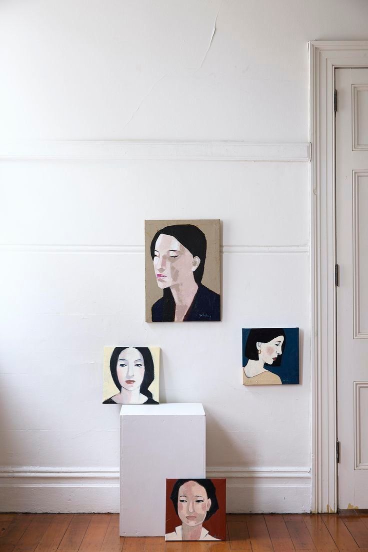Four Small Portrait Paintings Arranged On A White Wall In A Sparse Room — Everyday Interiors in Helensburgh, NSW