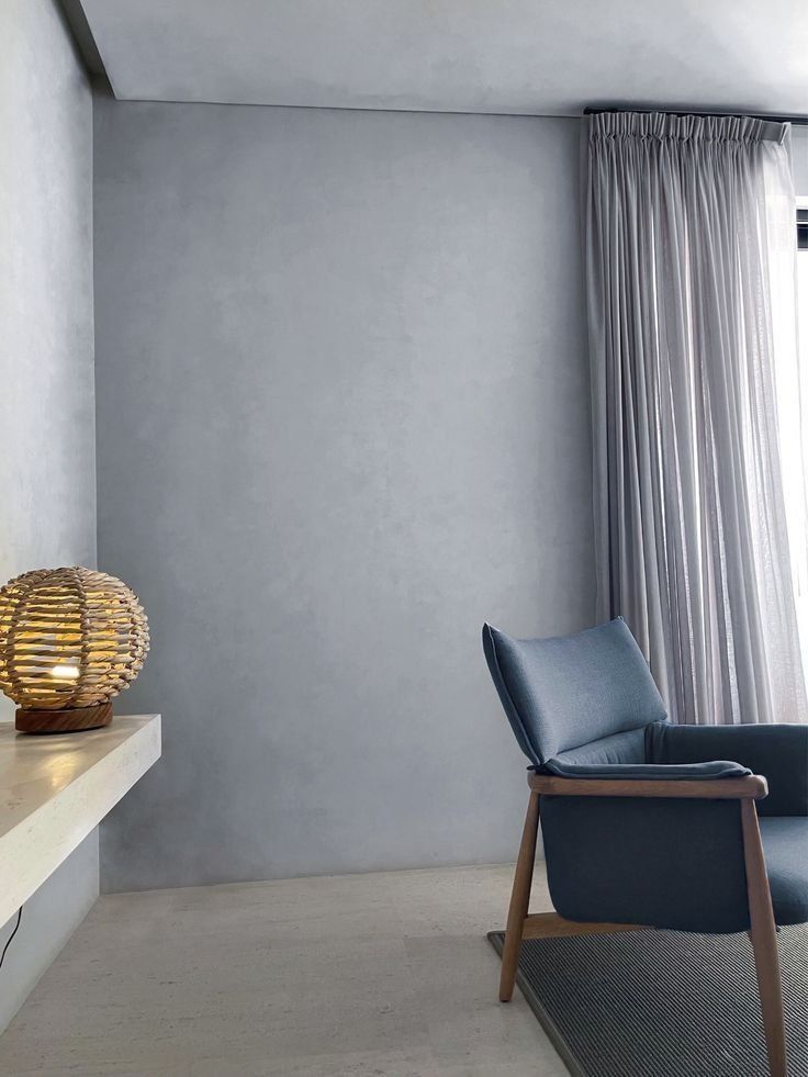 Minimalist Living Room Corner With Blue Chair And Sheer Curtains — Everyday Interiors in Helensburgh, NSW