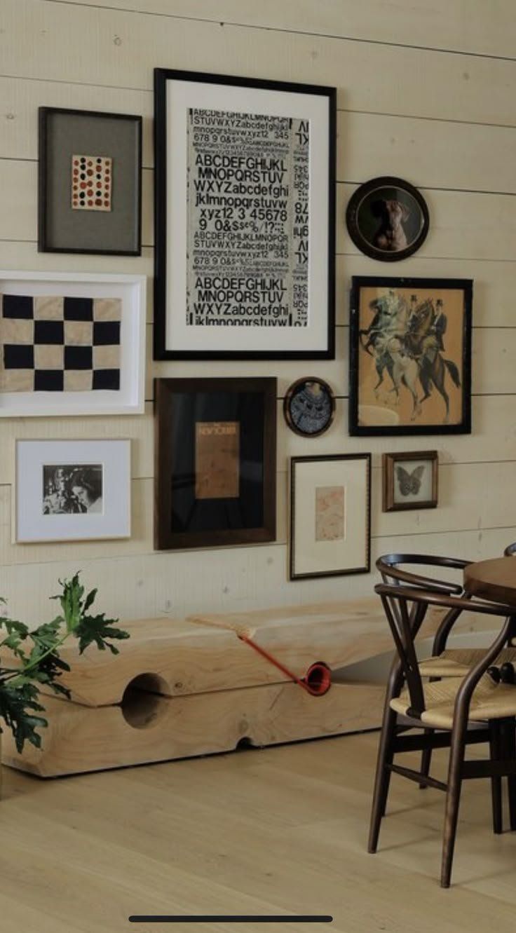 Framed Artwork Gallery Wall Above A Bench In A Beige Room — Everyday Interiors in Helensburgh, NSW