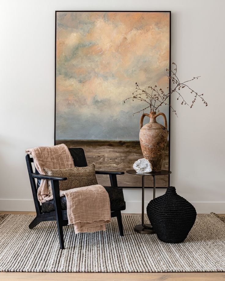 Cozy Corner With Abstract Wall Art, Woven Chair, Side Table And A Vase — Everyday Interiors in Helensburgh, NSW