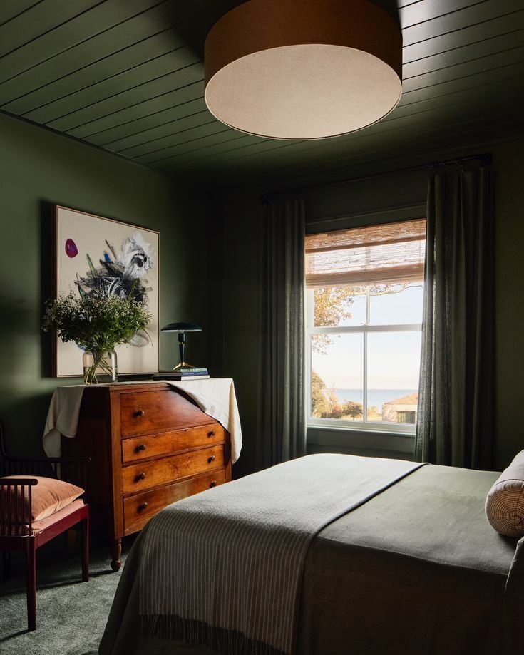 Cozy Bedroom With Dark Walls, A Bed And A Wooden Dresser — Everyday Interiors in Helensburgh, NSW