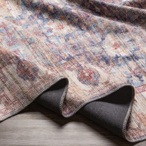 Folded Patterned Rug With Floral Design, Showing Gray Backing — Everyday Interiors in Helensburgh, NSW