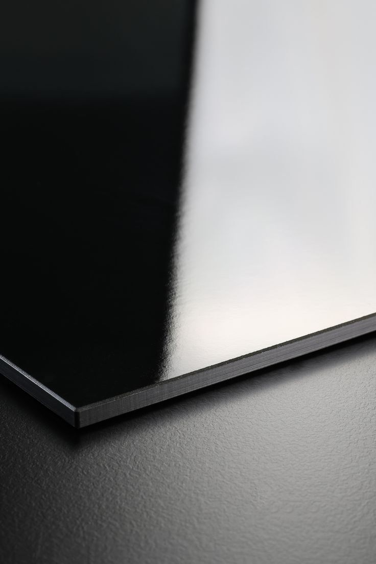 Close Up Of A Glossy Black And White Notebook Corner — Everyday Interiors in Helensburgh, NSW