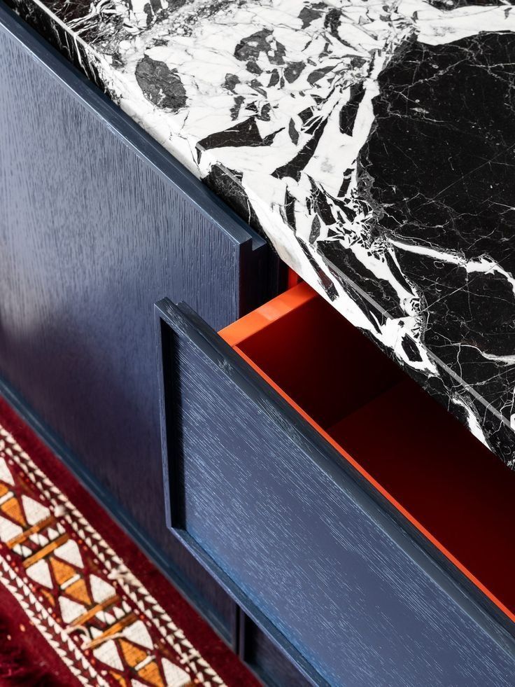 Blue Cabinet With A Red Drawer Beneath A Black And White Marble — Everyday Interiors in Helensburgh, NSW