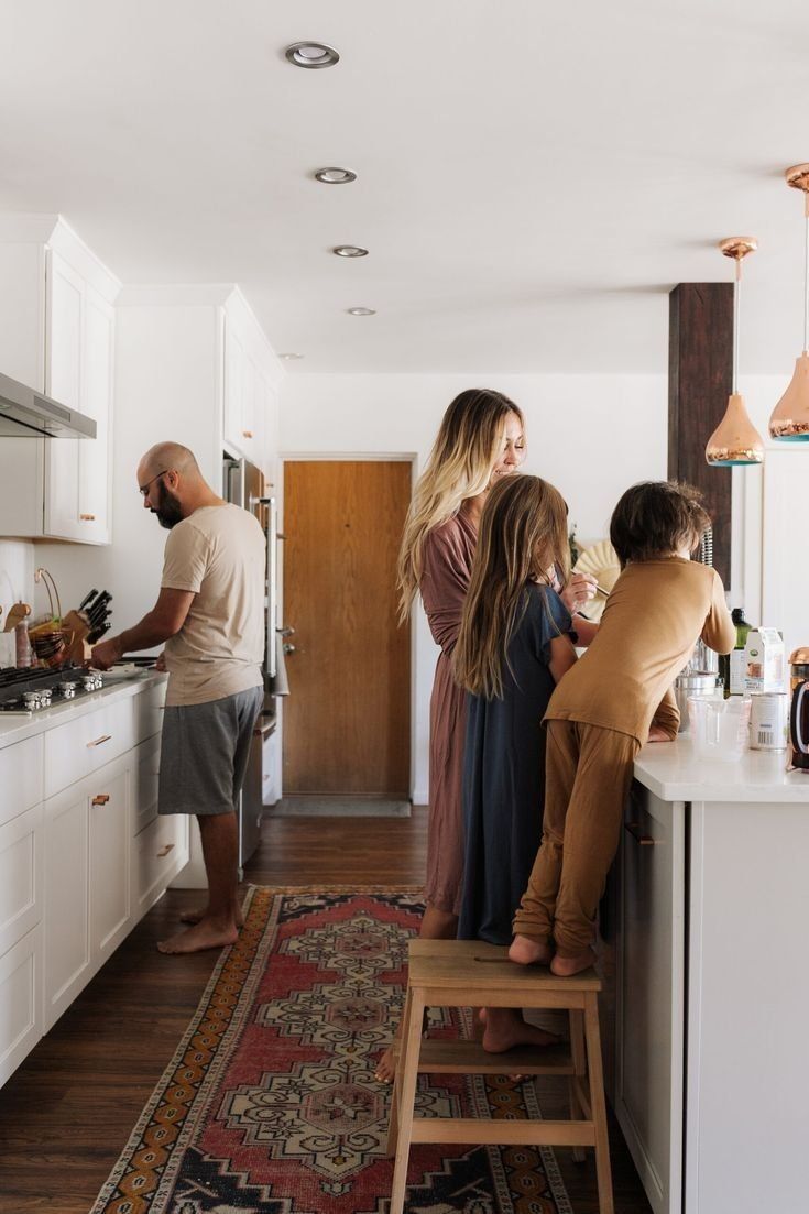 People Standing In A Bright Kitchen, One At The Sink — Everyday Interiors in Helensburgh, NSW