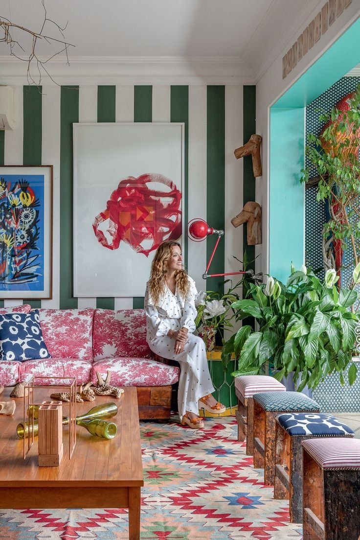 Woman Sitting In A Colorful Living Room With Striped Walls — Everyday Interiors in Helensburgh, NSW