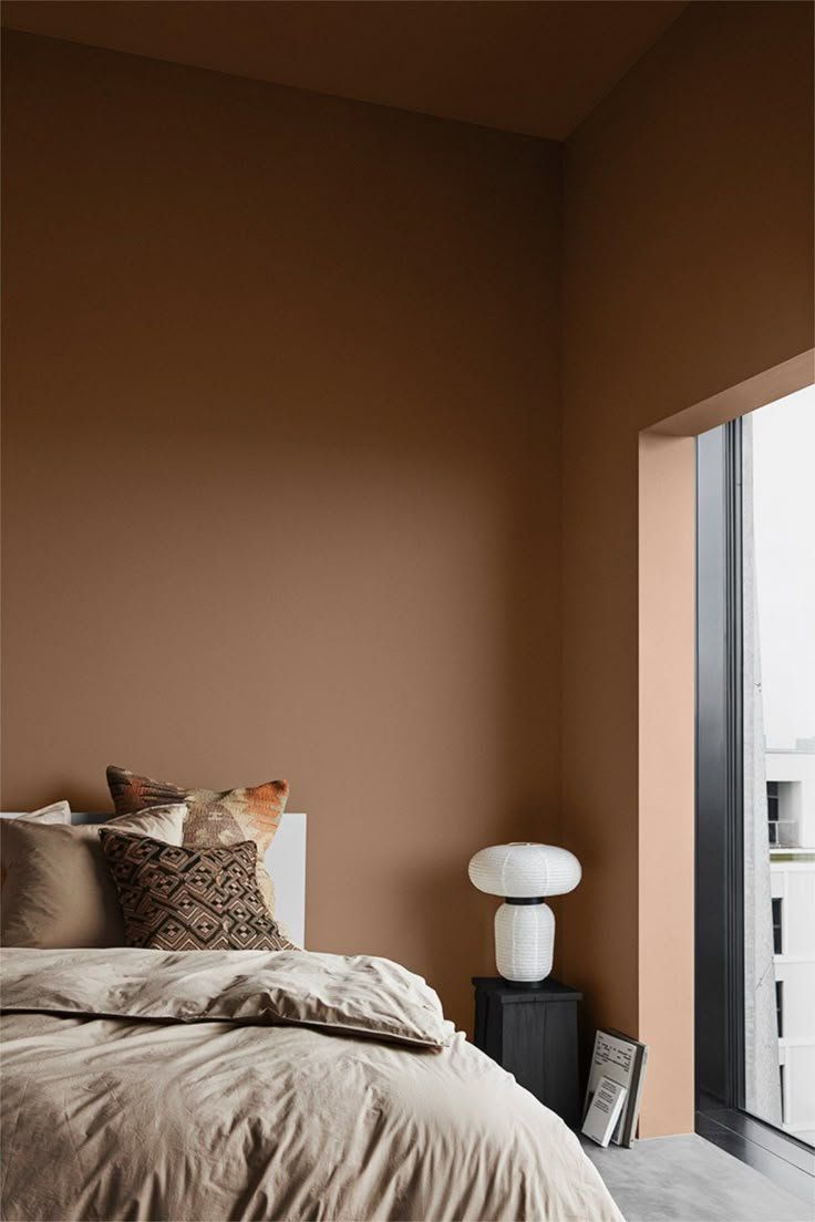 Minimal Bedroom With Brown Walls, Unmade Bed And A Sliding Glass — Everyday Interiors in Helensburgh, NSW