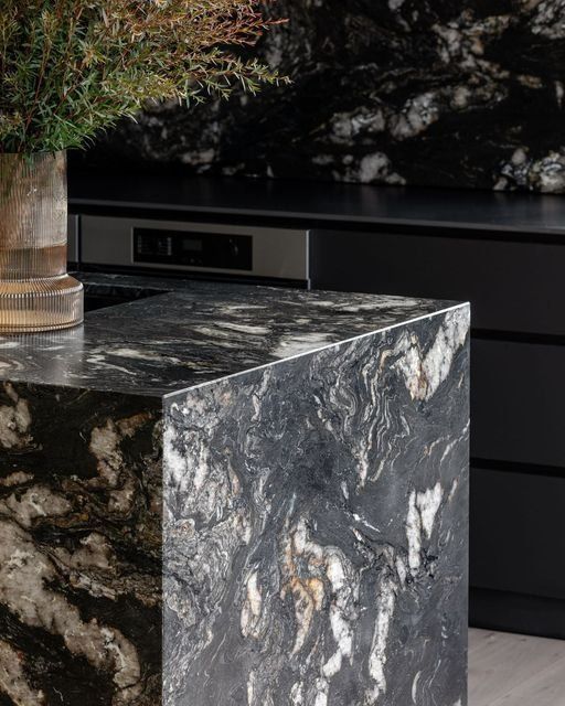 Marble Countertop Beside A Dark Modern Cabinet In A Kitchen — Everyday Interiors in Helensburgh, NSW
