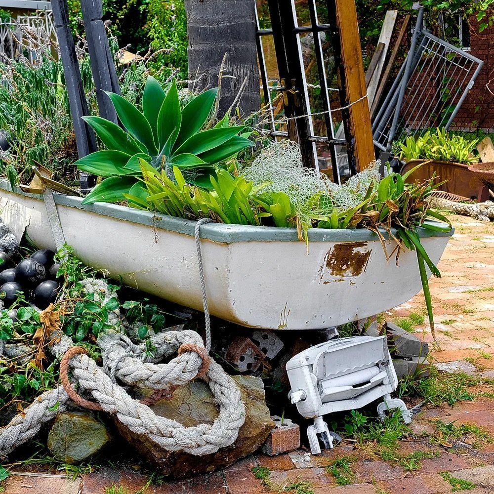 White Planter Filled With Succulents And Greenery In A Garden — Everyday Interiors in Helensburgh, NSW