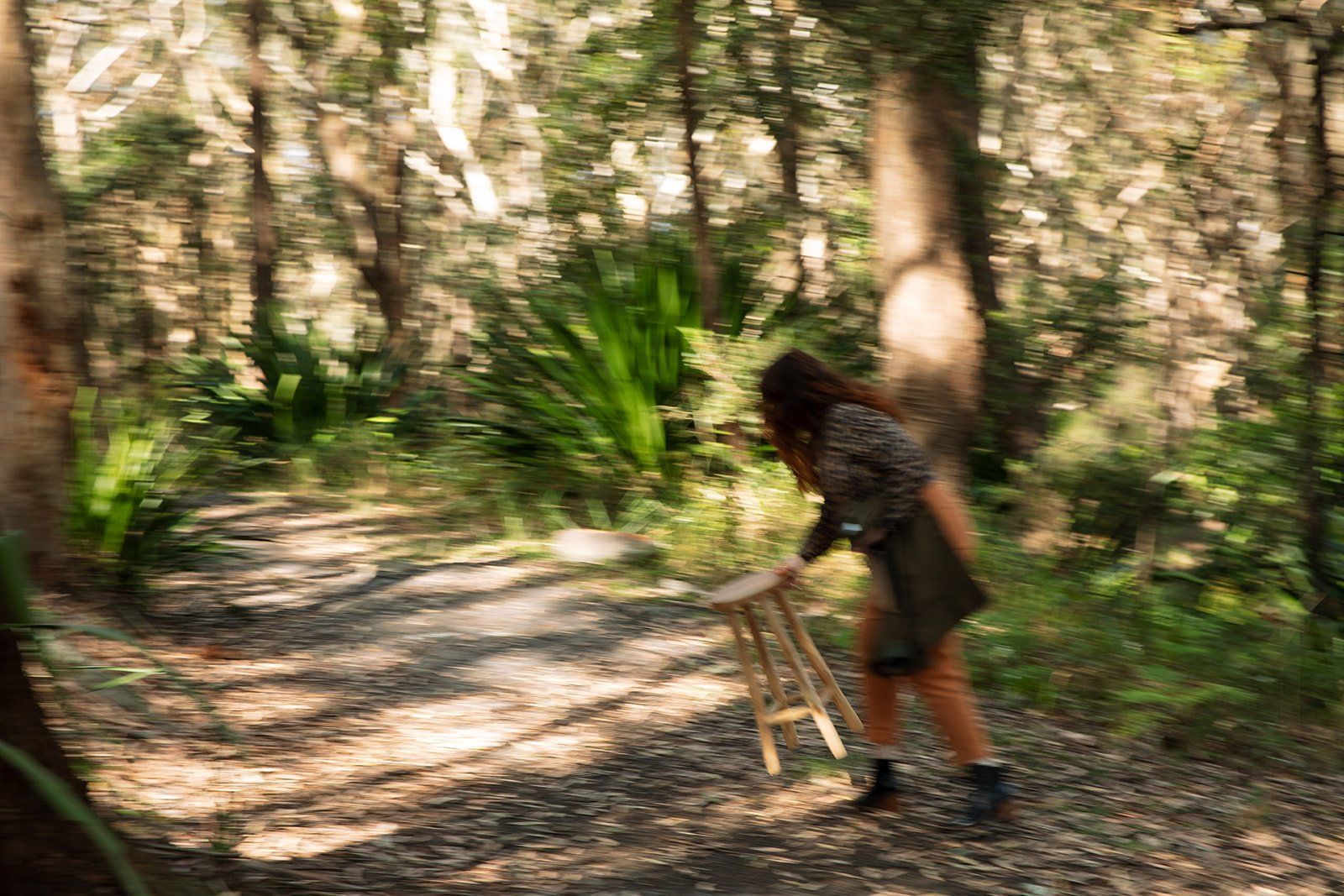 Person Bending Over A Small Stool On A Forest Trail — Everyday Interiors in Helensburgh, NSW