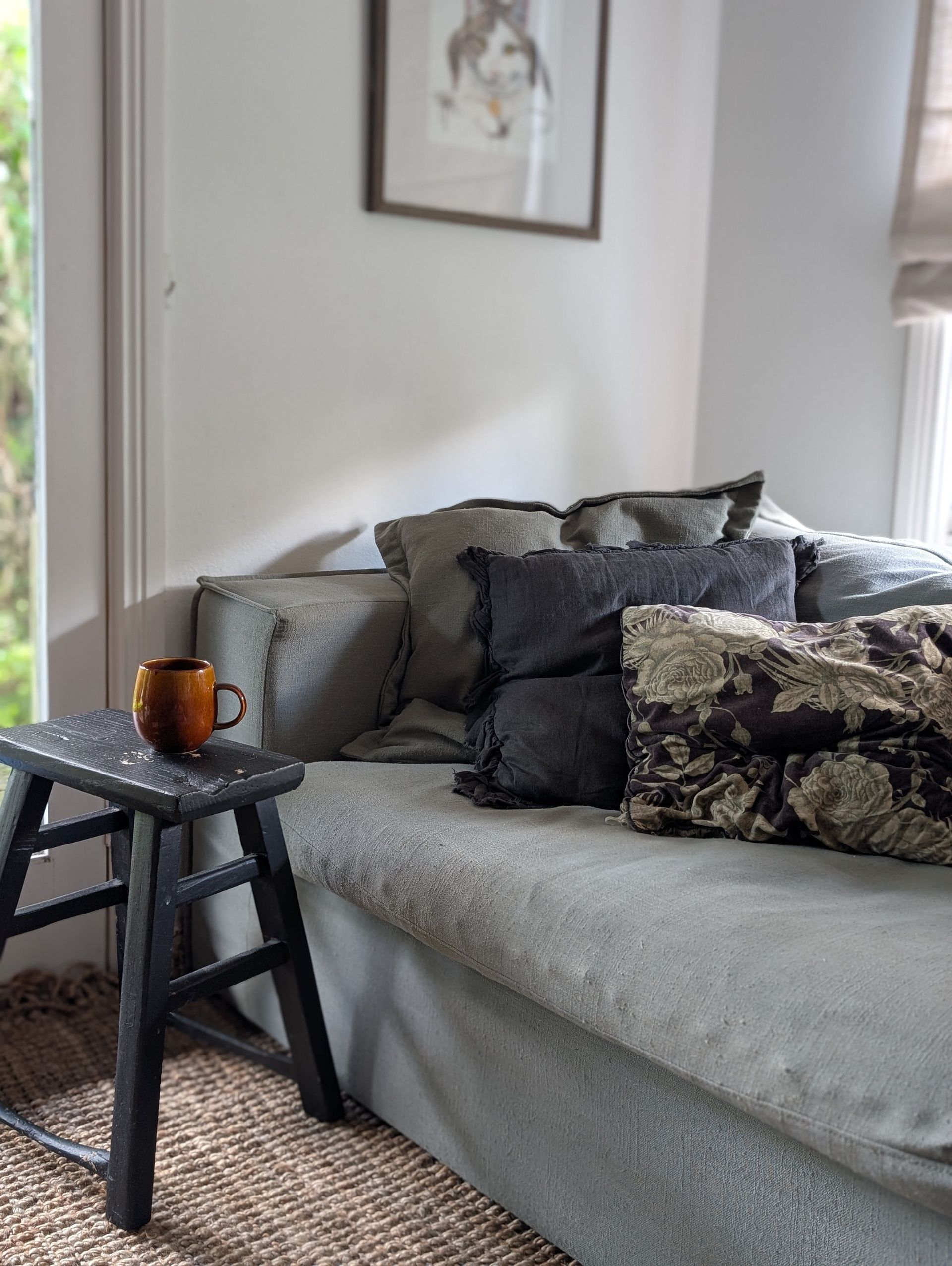 Gray Sofa With Patterned Pillows Beside A Black Side Table — Everyday Interiors in Helensburgh, NSW