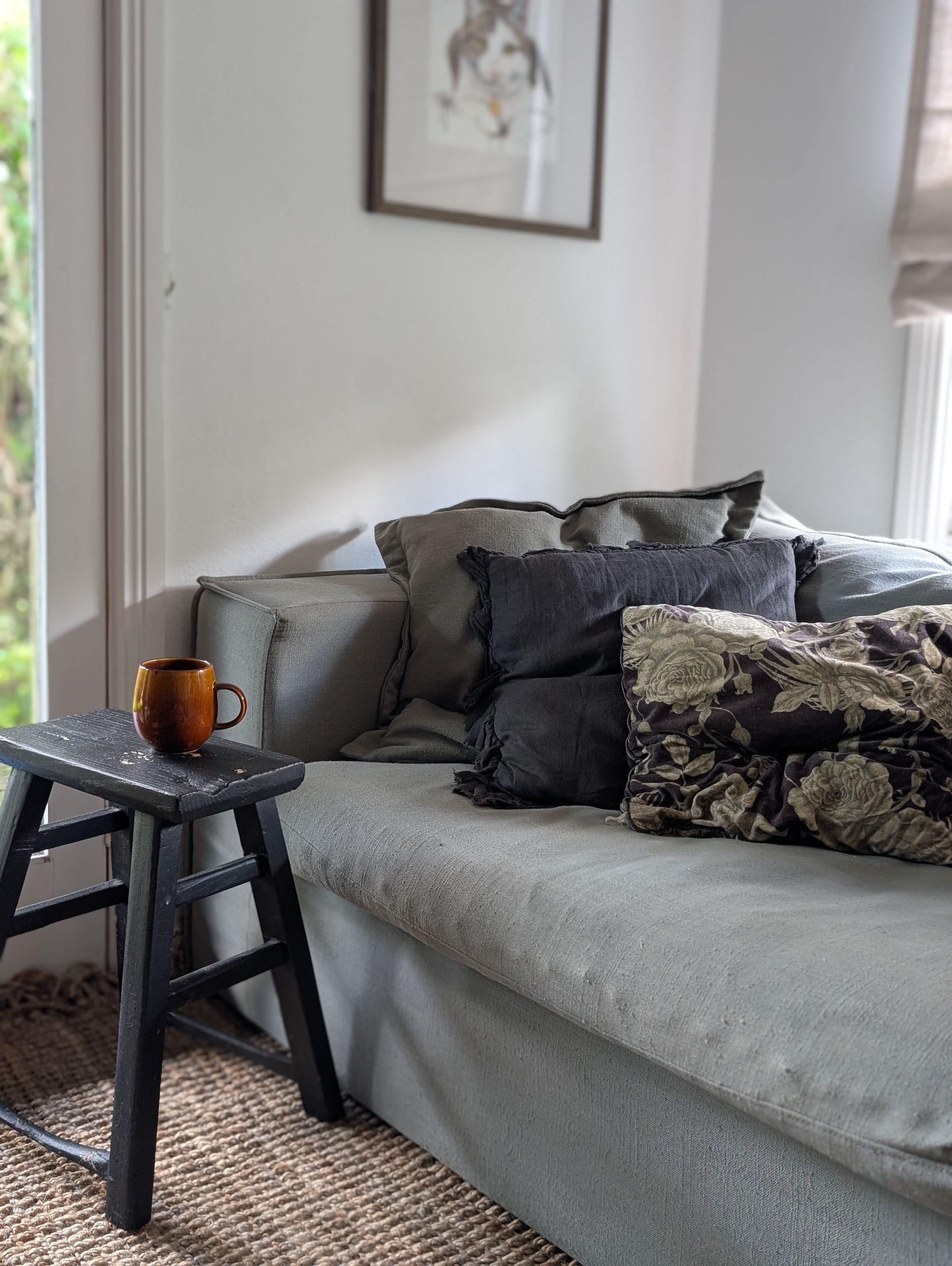 Gray Sectional Sofa With Patterned Pillows And A Black Side Table — Everyday Interiors in Helensburgh, NSW