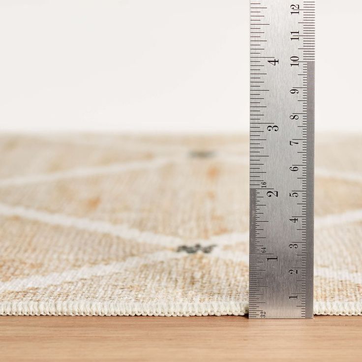 Metal Ruler Measuring The Thickness Of A Light Beige Woven Fabric — Everyday Interiors in Helensburgh, NSW