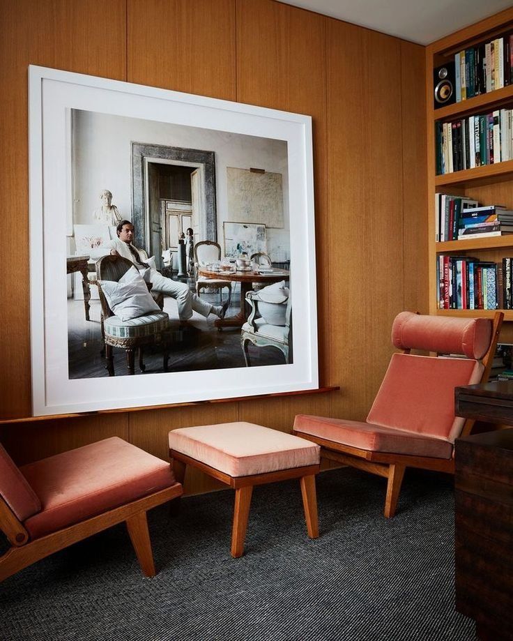Wood Paneled Room With Framed Artwork And A Two Red Lounge Chairs — Everyday Interiors in Helensburgh, NSW