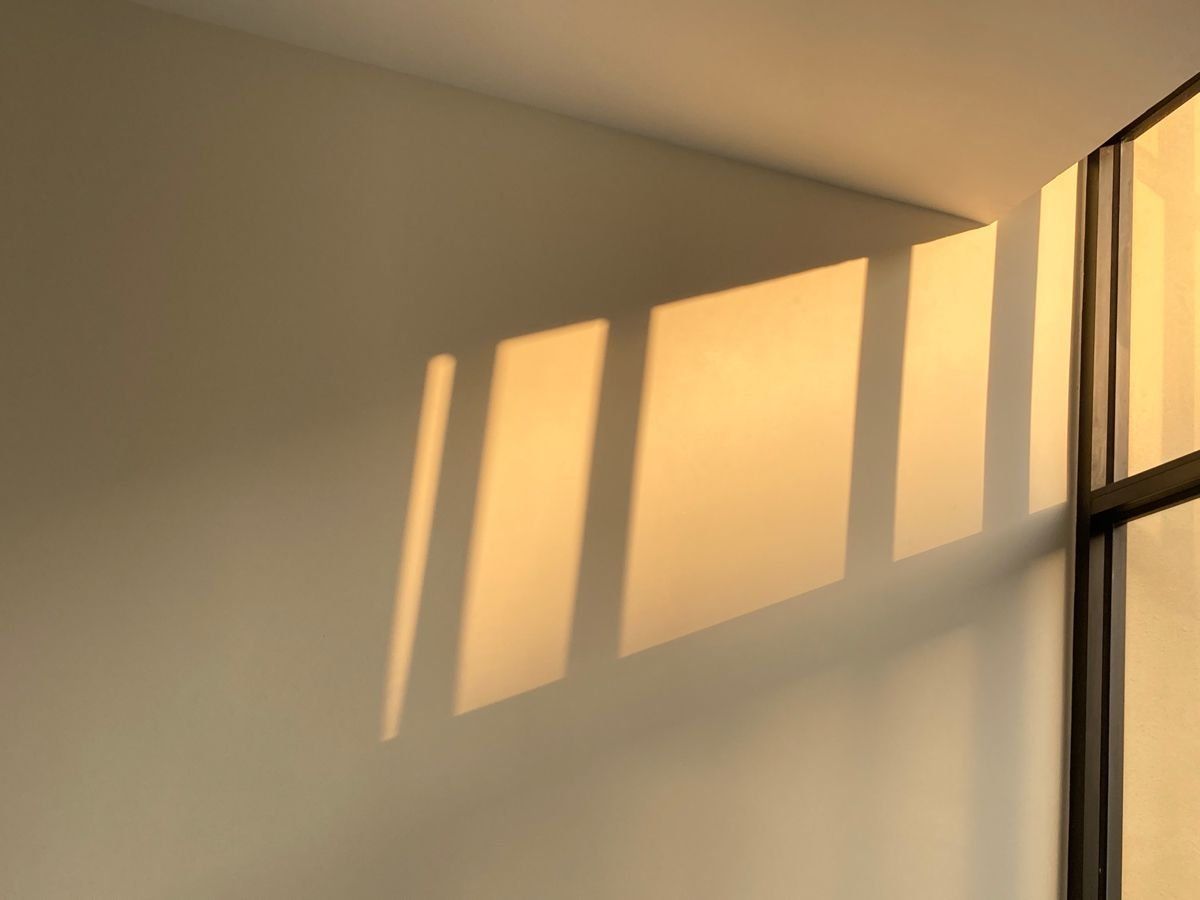 Sunlight Casting Warm Rectangular Shadows On A Beige Wall Near A Window — Everyday Interiors in Helensburgh, NSW