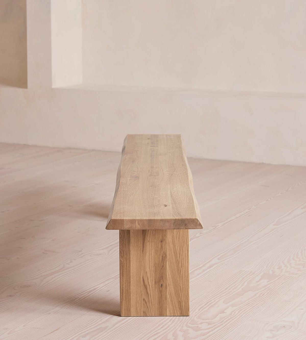 A Small Wooden Bench On A Light Wood Floor Against A Pale Wall — Everyday Interiors in Helensburgh, NSW