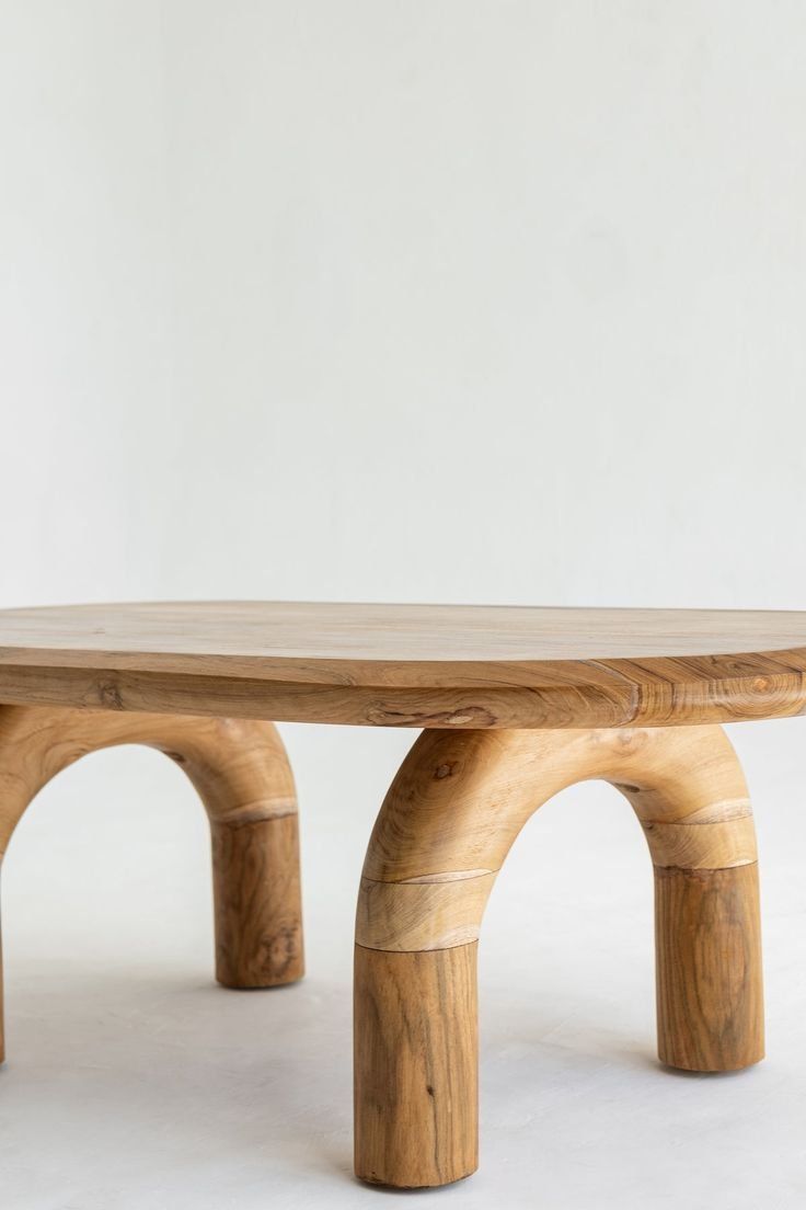 Rustic Wooden Bench With Arched Legs Against A Plain White Wall — Everyday Interiors in Helensburgh, NSW