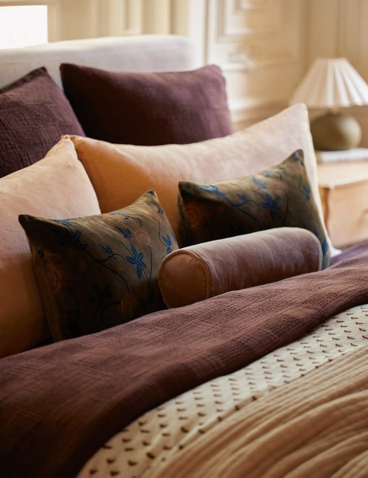 Plush Burgundy And Cream Pillows Layered On A Bed In A Softly Bedroom — Everyday Interiors in Helensburgh, NSW