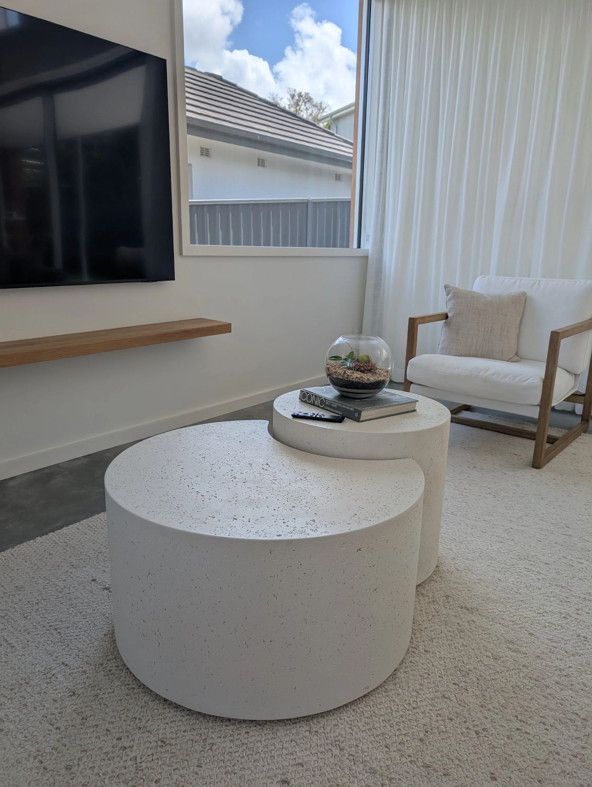 Modern Living Room With White Speckled Ottoman, Chair And A TV — Everyday Interiors in Helensburgh, NSW