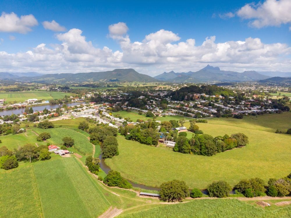 An Aerial View Of A Lush Green Landscape With Mountains In The Background — Premier Roofing Solutions In Murwillumbah, NSW