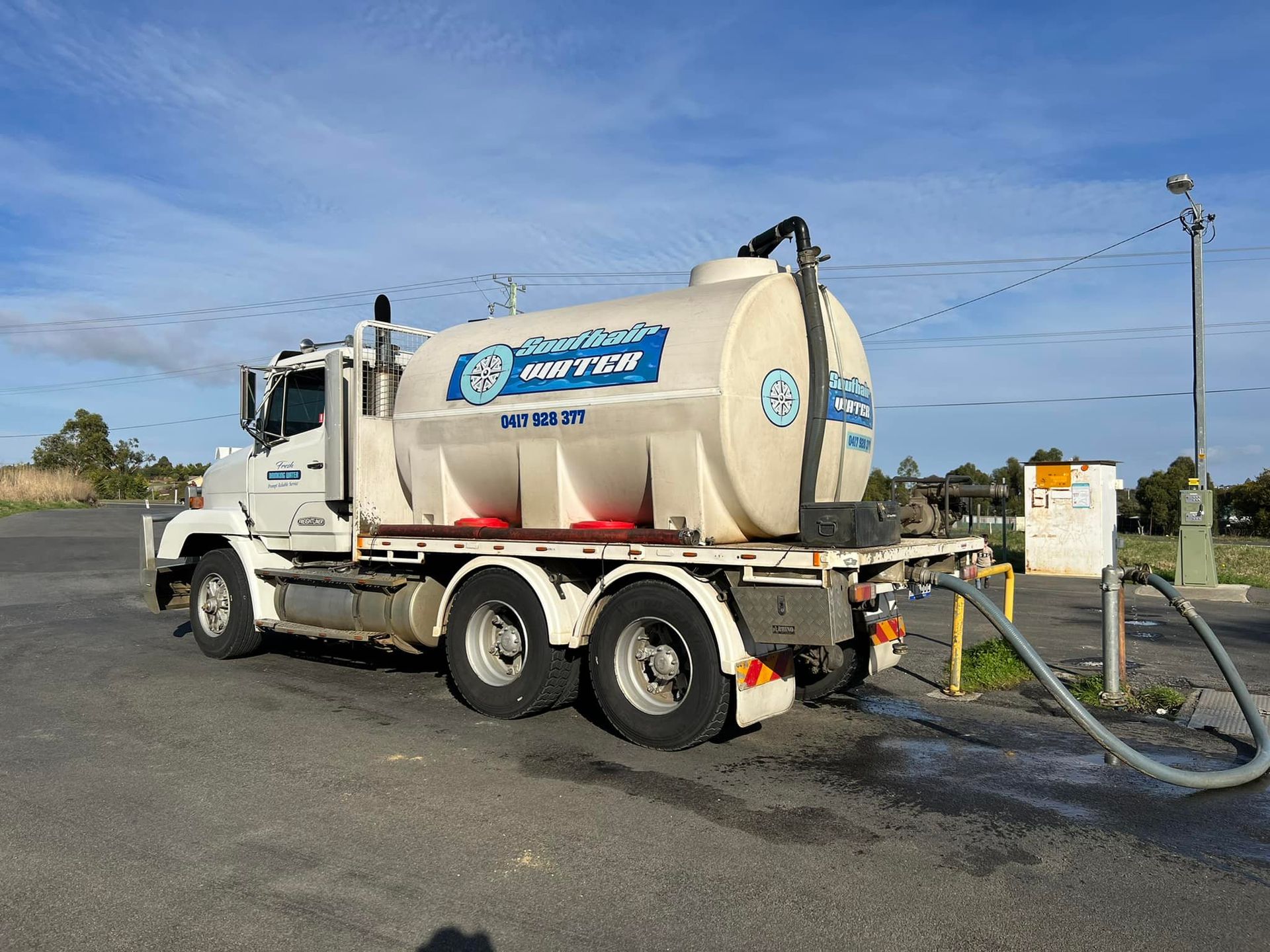 White Vacuum Truck With Hoses Parked on Pavement — SOUTHAIR WATER In Mornington, TAS