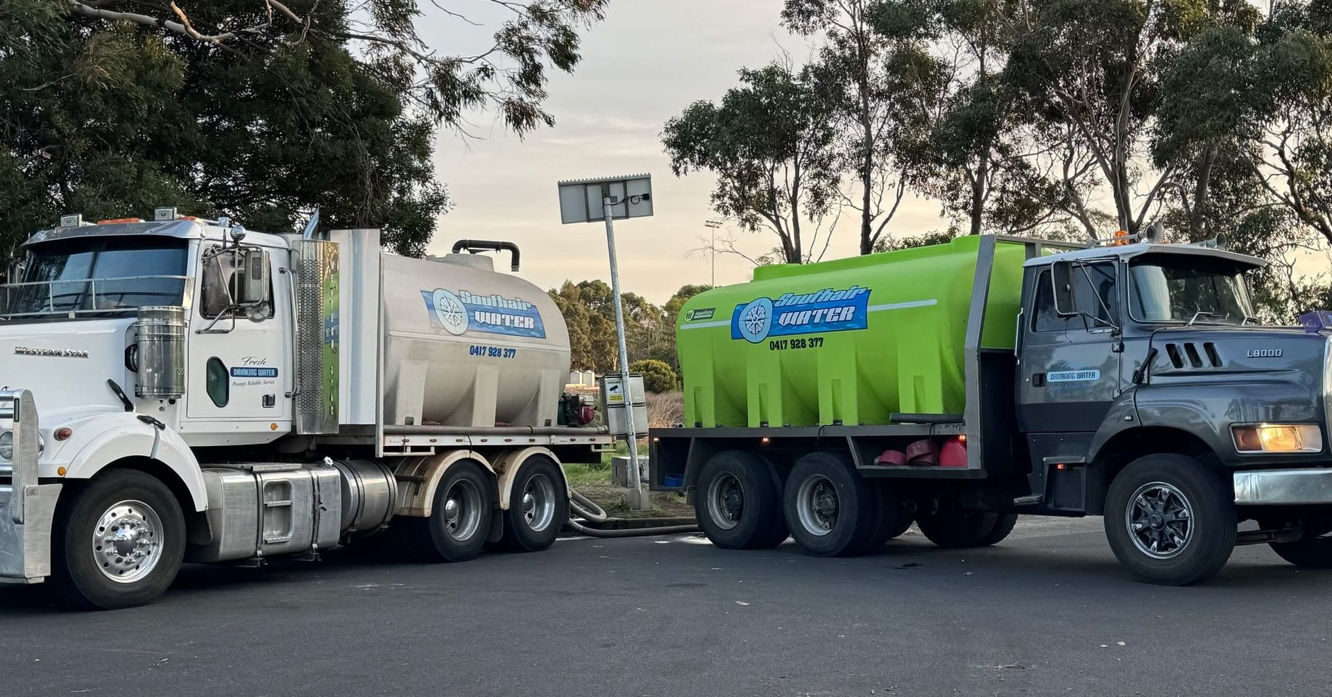 Two Tanker Trucks Parked Side-by-side, One White — SOUTHAIR WATER In Mornington, TAS