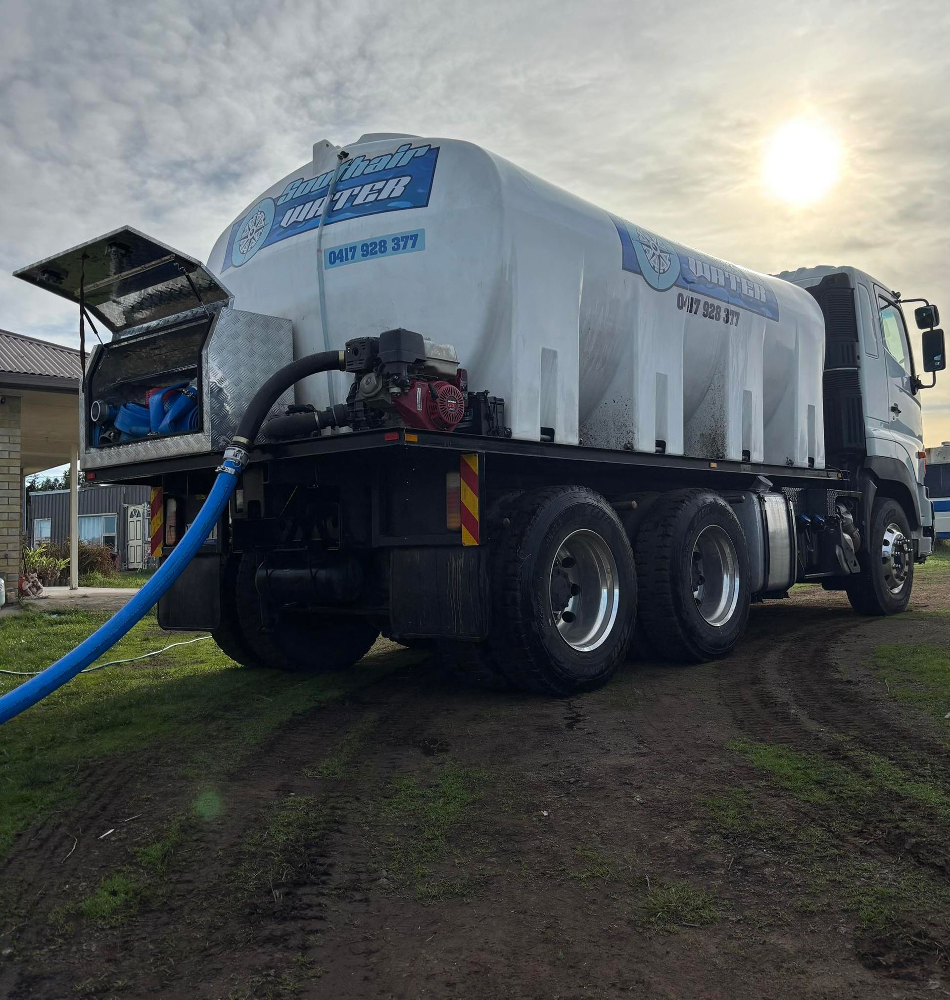 A Large White Water Tank Truck Parked on a Dirt Path — SOUTHAIR WATER In Mornington, TAS