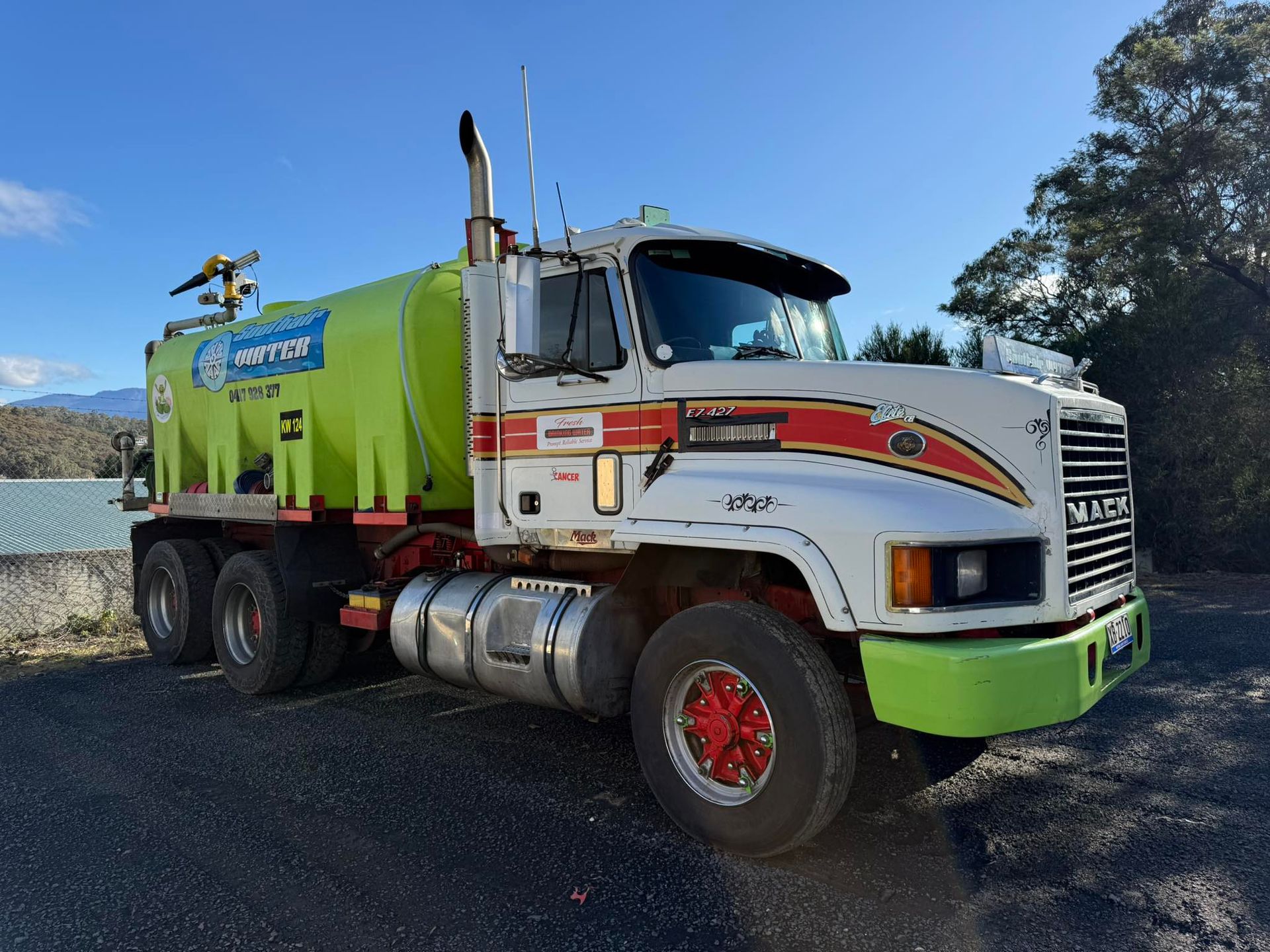 A White and Lime Green Water Truck Parked on a Gravel Surface — SOUTHAIR WATER In Mornington, TAS