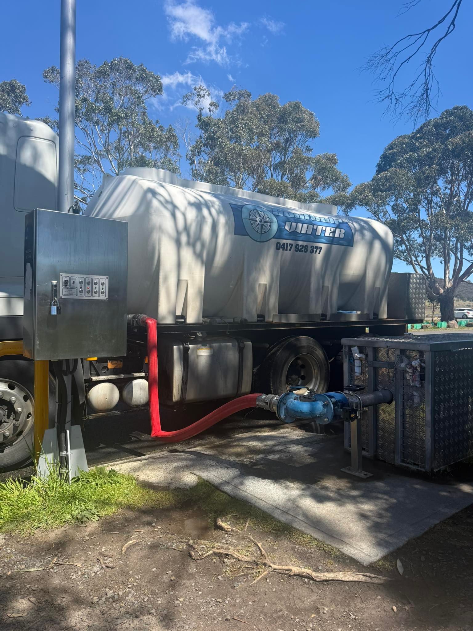 A White Industrial Water Tank Trailer Connected to a Metallic Container — SOUTHAIR WATER In Mornington, TAS