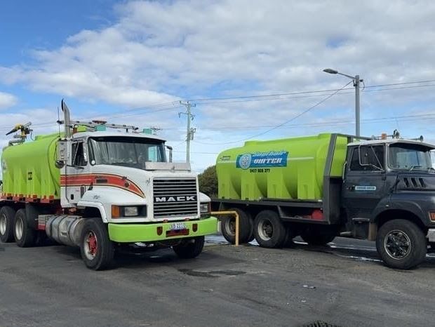 Two Large Industrial Tanker Trucks, One White and One Dark Grey — SOUTHAIR WATER In Mornington, TAS