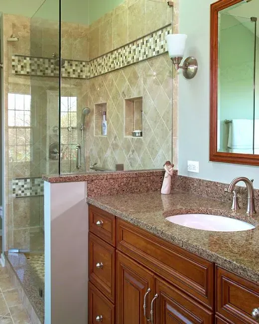Bathroom with wooden vanity, granite countertop, round sink, and tiled shower in the background in Modern kitchen with gray cabinets, island, pendant lights, exposed wood beams, and two barstools in Arlington Heights, IL.