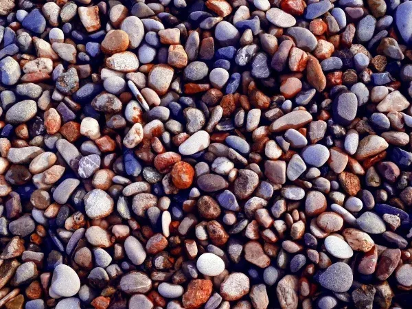 Decorative rock installation in Argyle TX enhancing landscape design with durable low maintenance ground cover