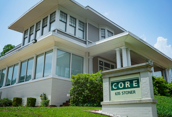 Modern building with large windows and a sign reading “CORE” at 675 Stoner