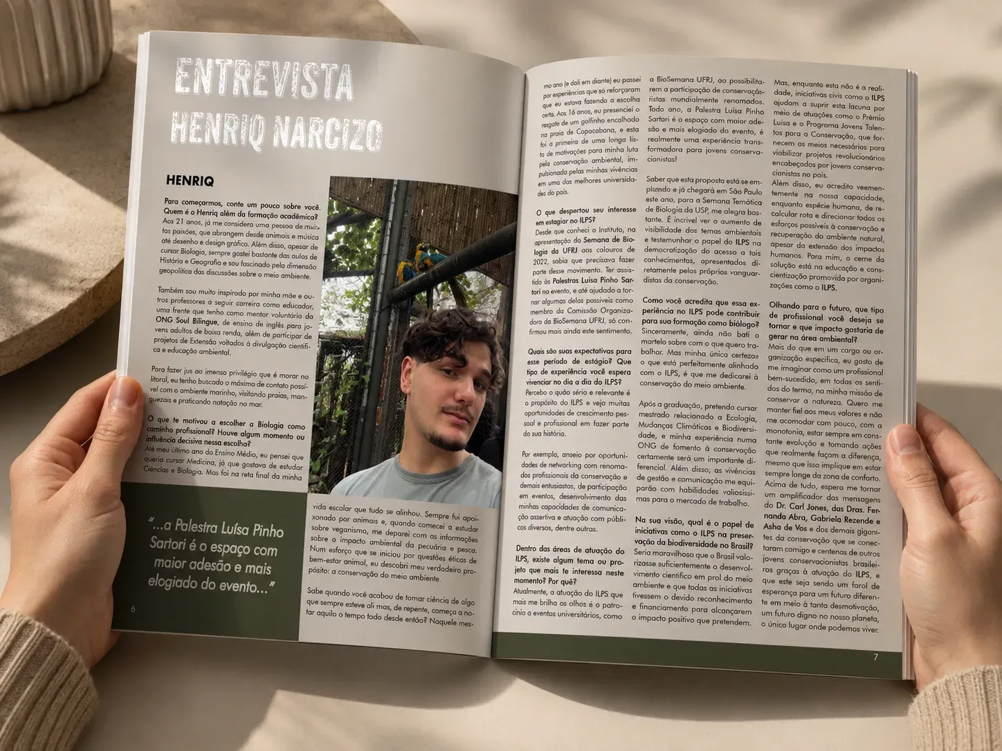 Open magazine showing a interview spread with photos and text, held open by two hands