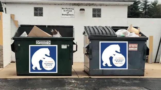 Blue trash bins overflowing with food waste and litter sit in a grassy area lined with white event tents.