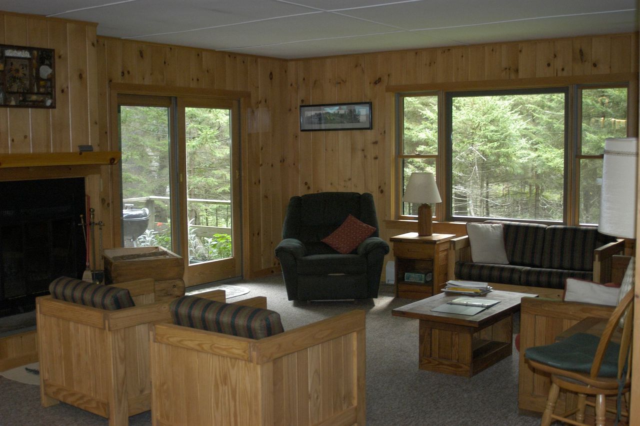 a living room filled with furniture and a fireplace