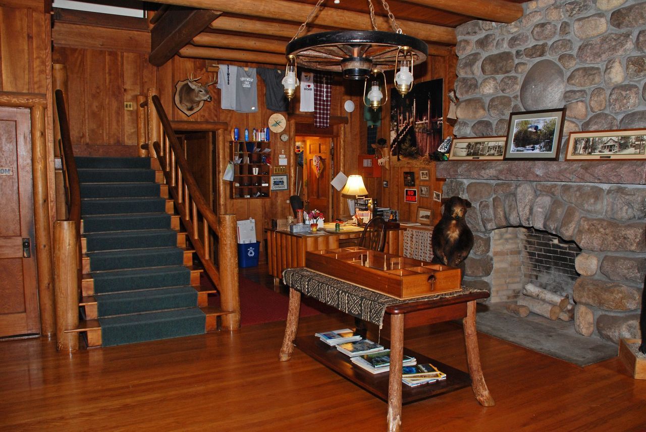a room with a table and stairs in it
