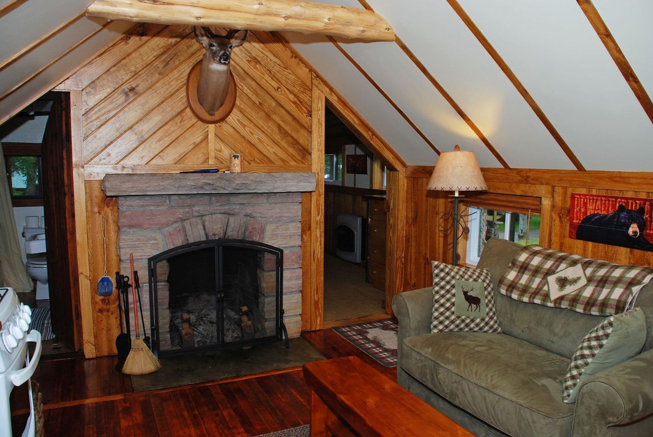 a living room with a fireplace and a couch