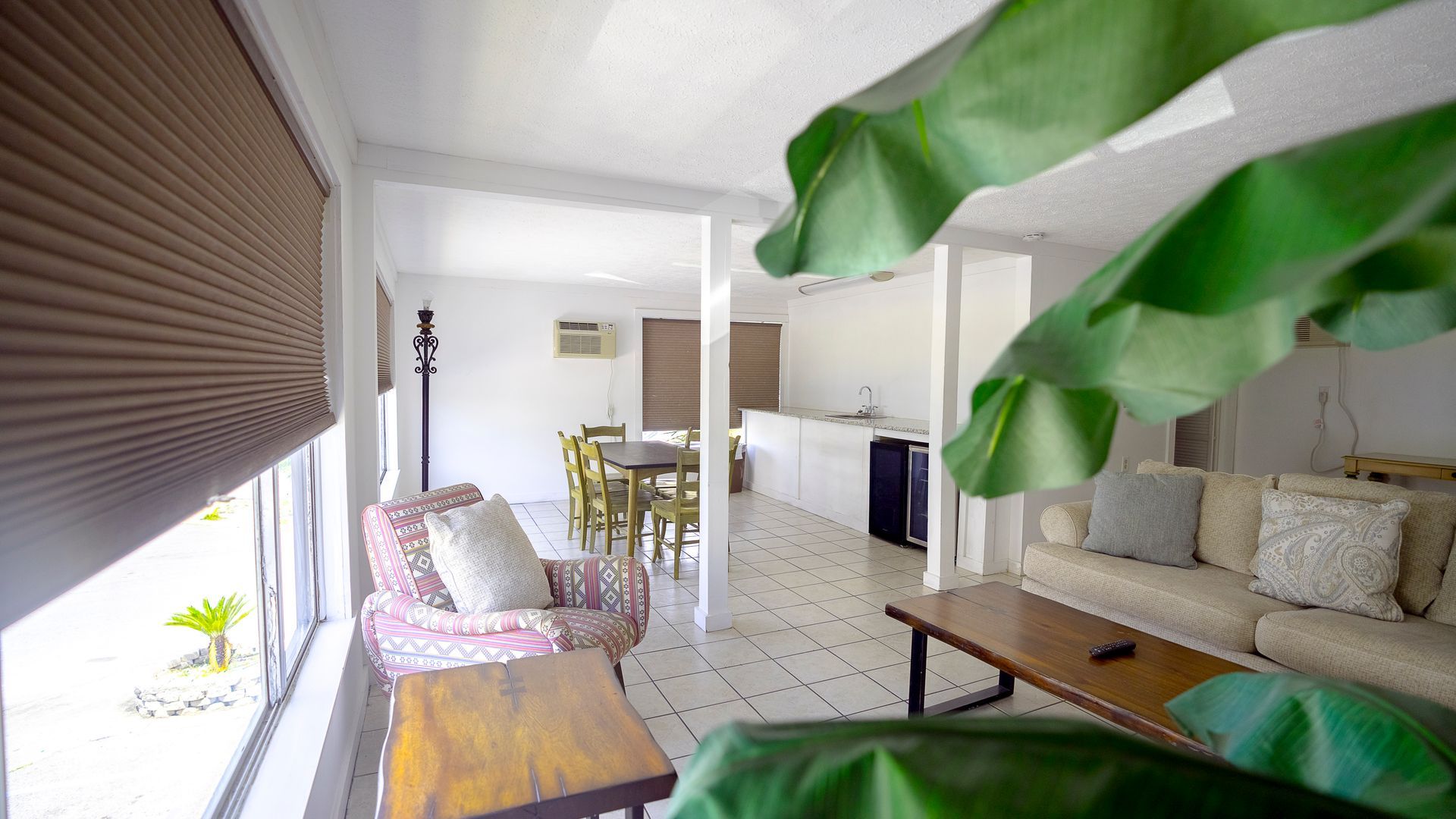 A living room with a couch , chair and table