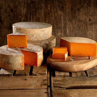 Aged Rutland Red - Made using a traditional recipe, Rutland Red is buttered, cloth-bound and matured for six months to produce a flaky, open texture cheese with a slightly sweet, caramelised flavour and rich golden orange colour. It is the only pasteurised Red Leicester produced in the county of Leicestershire and is a firm favourite at Long Clawson Dairy. Pasteurised Cow's milk & suitable for vegetarians. 