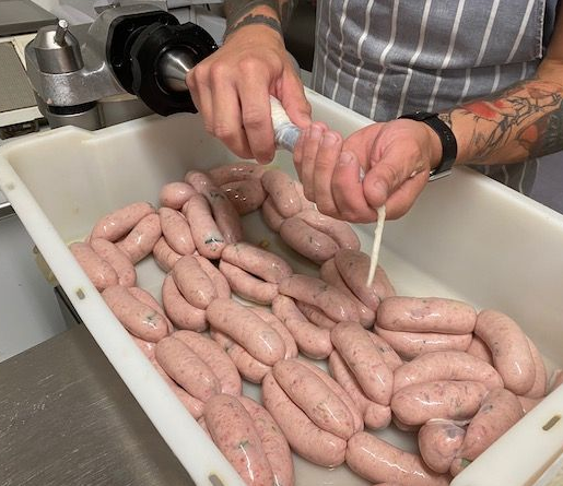 Tony Neary Butchers making sausages