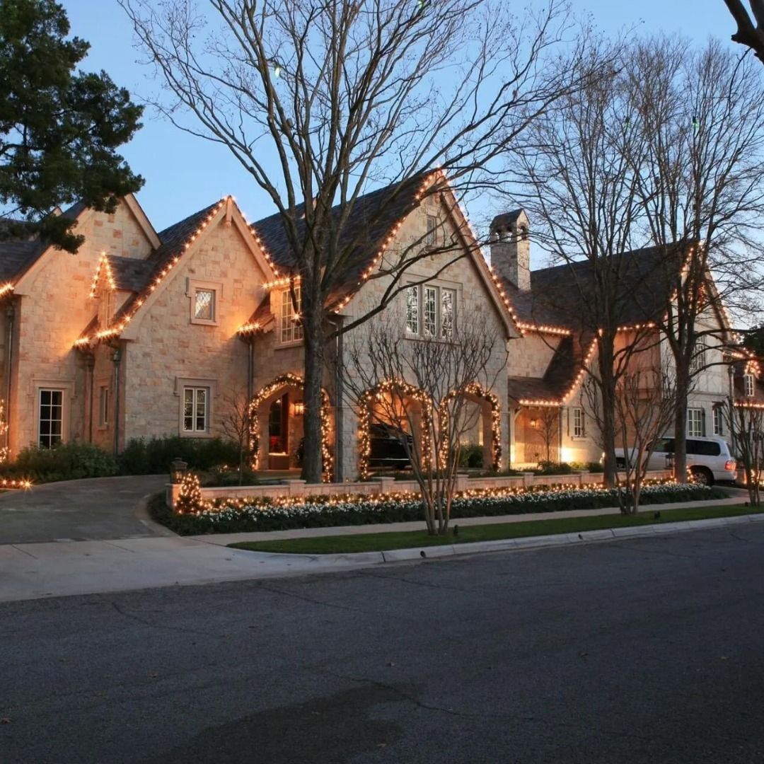 Festive holiday lights illuminating a Wayzata, MN home near Gleason Lake