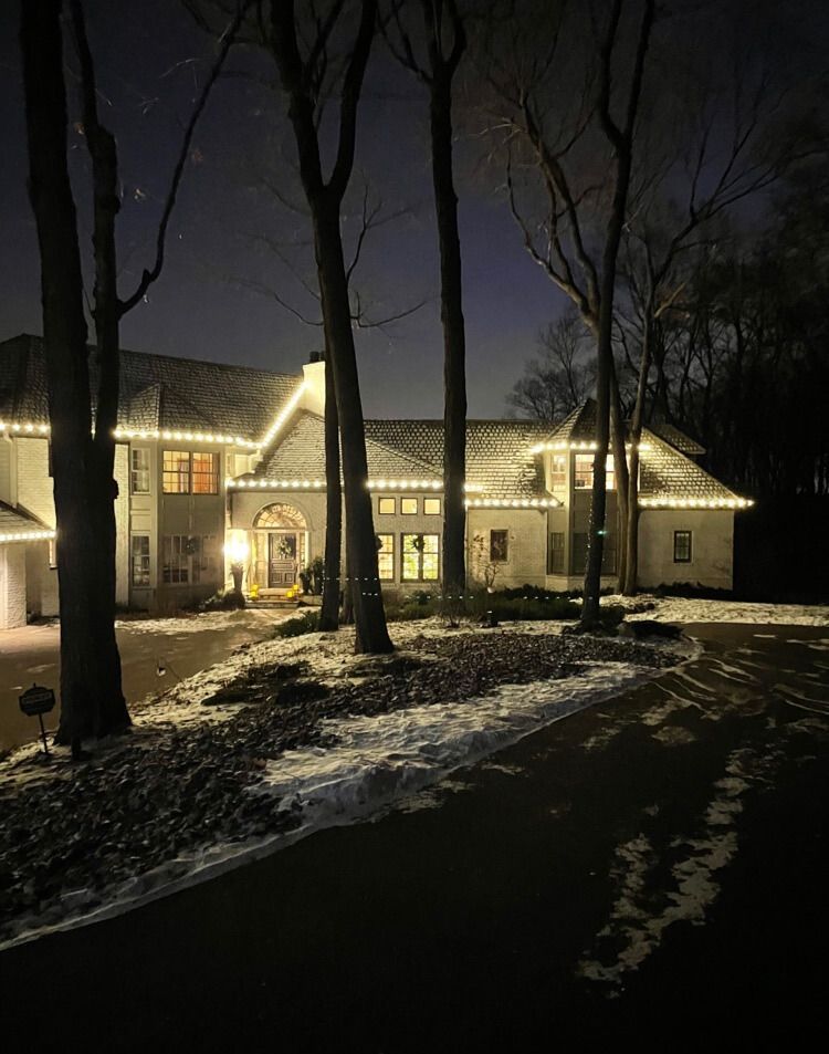 Bright and festive holiday lighting on a cozy Bloomington, MN residence lit by Jingle Bulbs