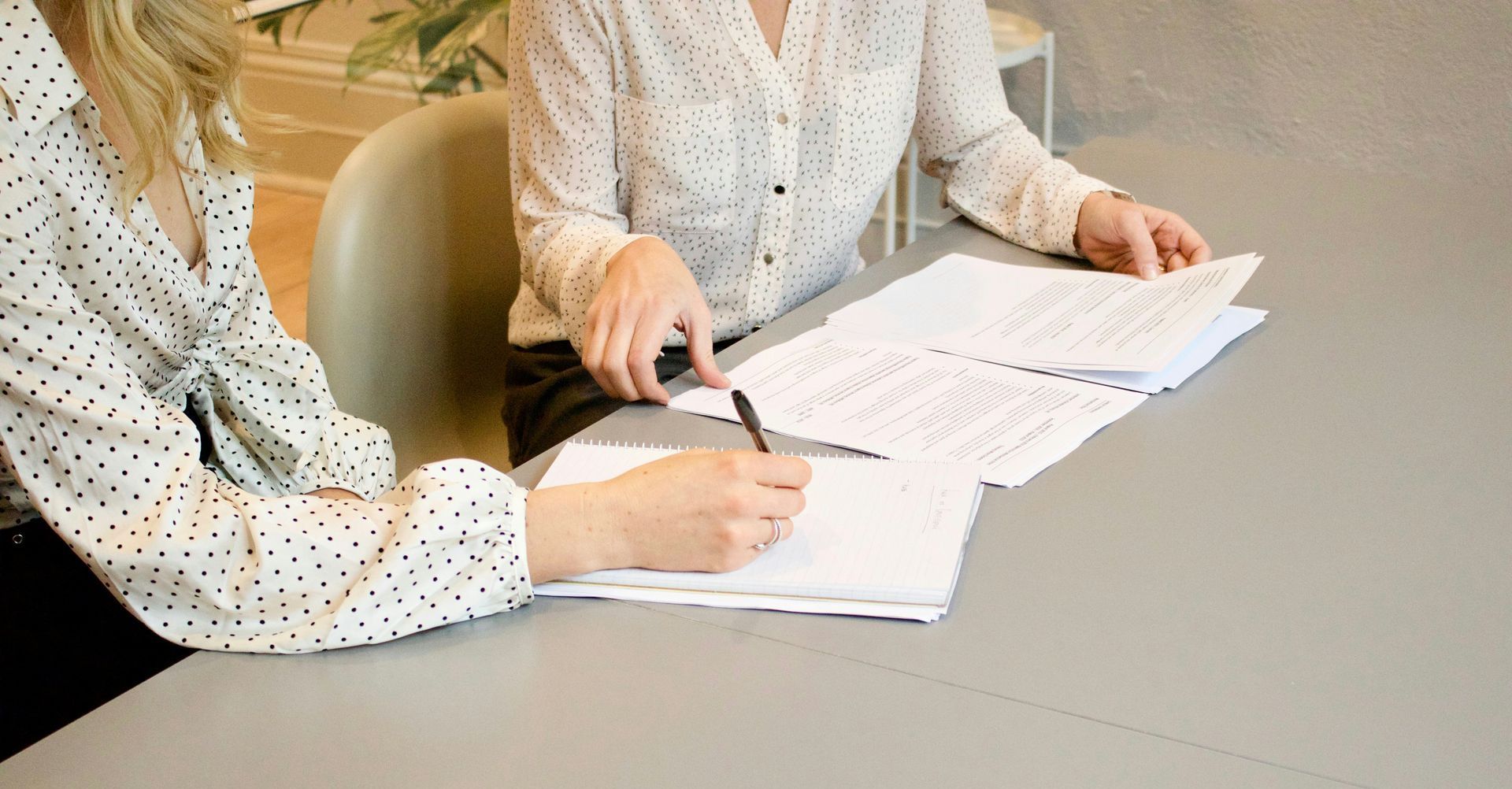 people signing document