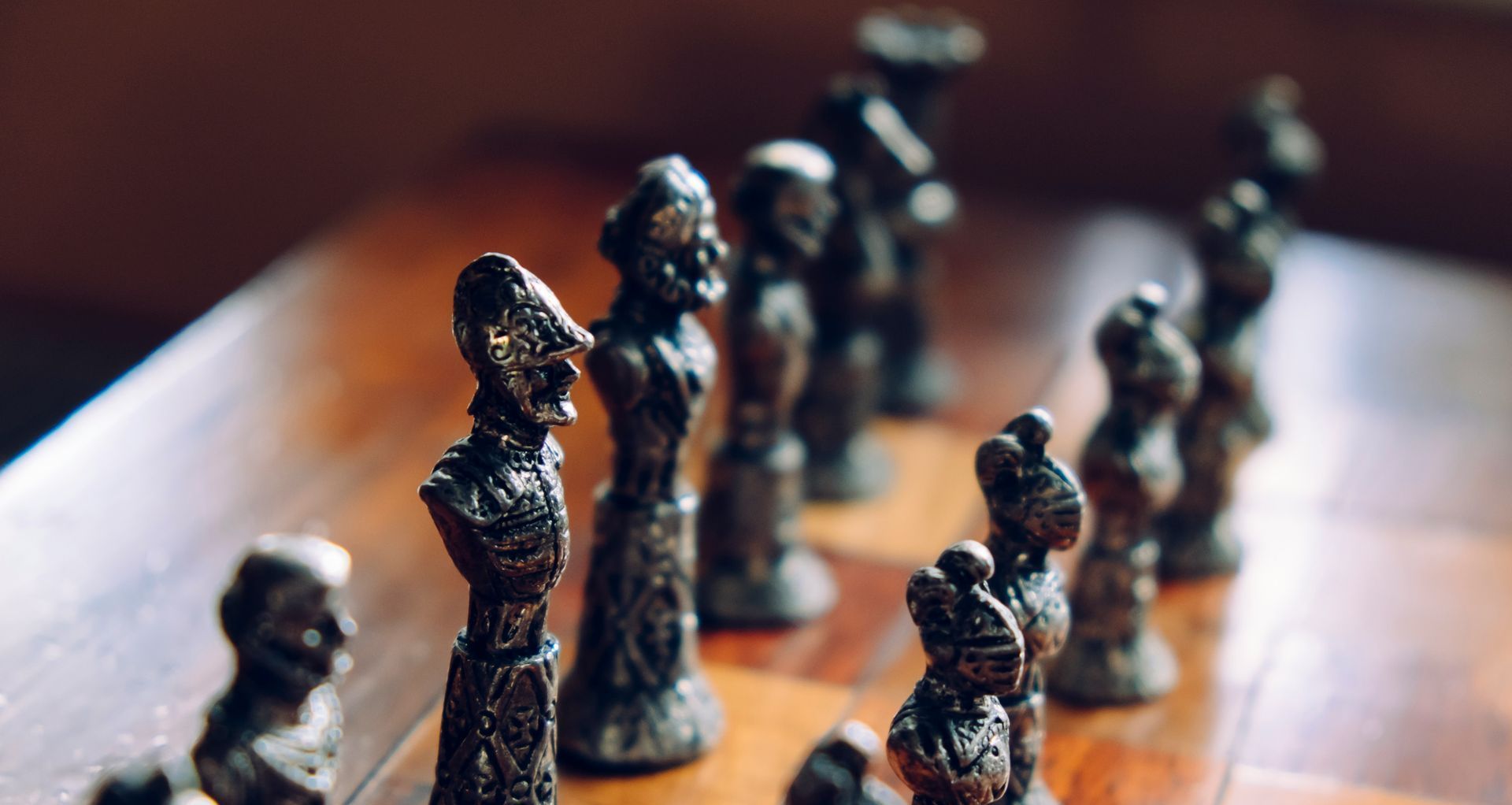 a close up of a chess board with chess pieces on it 