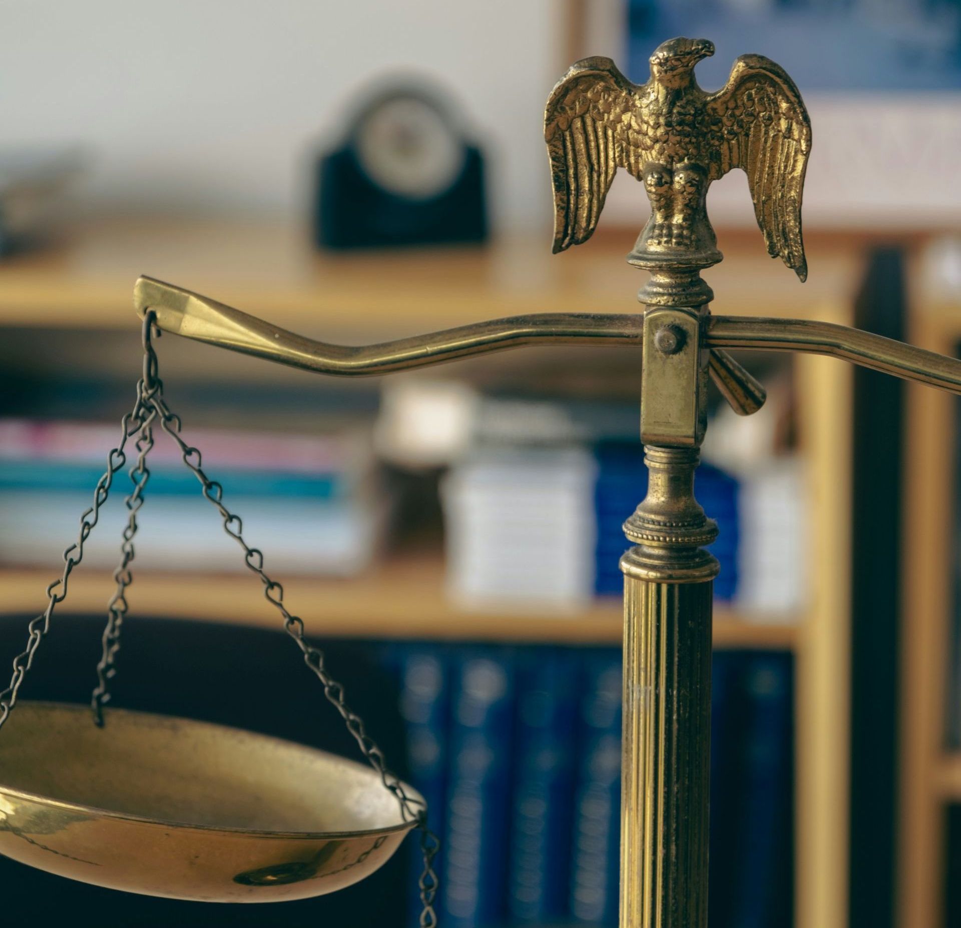 a brass scale with an eagle on top of it